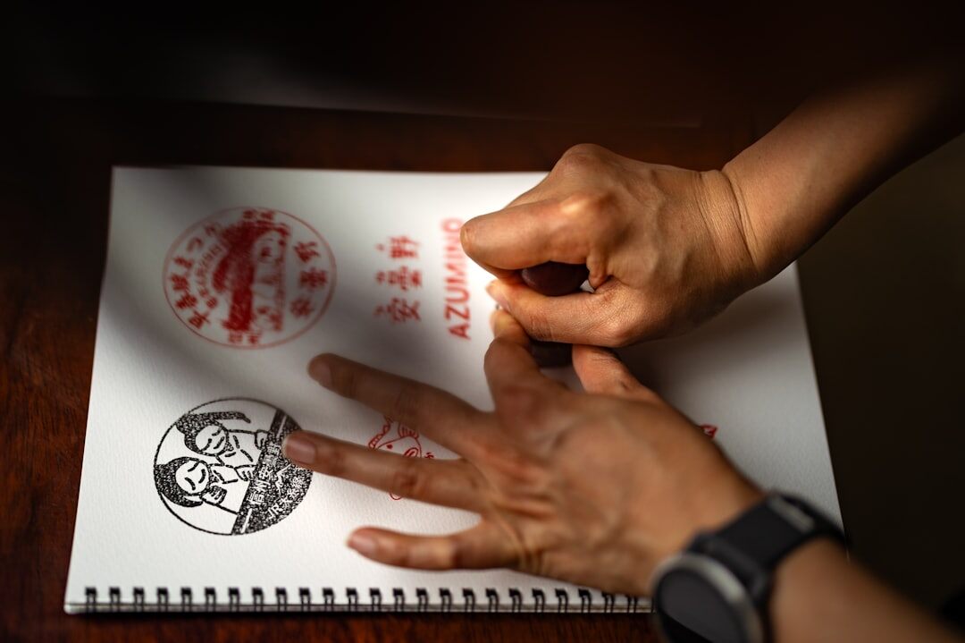 Notary stamping an official legal document with a seal